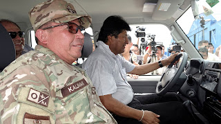 Bolivia's President Evo Morales, military forces Commander Williams Kaliman and government minister Carlos Romero (rear) attend the inauguration of a coca plant eradication program by the Bolivian government at the Chimore headquarters in the Chapare region, Bolivia, January 18, 2019. REUTERS/David Mercado