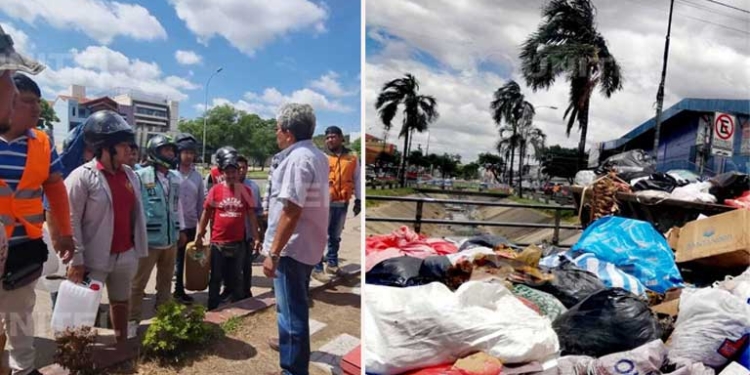 Conductores reciben explicación de un operador de surtidores y al costado basura acumulada. Fotos/Unitel